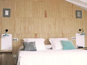 Voodi või voodid majutusasutuse Hotel Ayllon toas