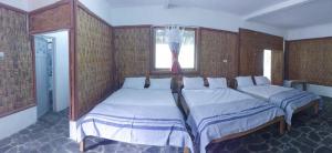 Letto o letti in una camera di Omah nDeso Argopeni