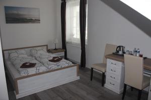 A bed or beds in a room at Penzion Vesely