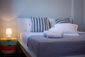 A bed or beds in a room at Casa Afrodite