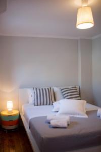 A bed or beds in a room at Casa Afrodite