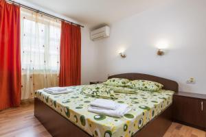 Katil atau katil-katil dalam bilik di Pensiunea Andrei Rm Valcea
