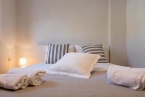 A bed or beds in a room at Casa Afrodite