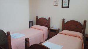 Postel nebo postele na pokoji v ubytování Agriturismo Il Salice Ridente