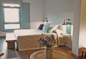 Voodi või voodid majutusasutuse Hotel Ayllon toas