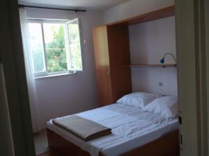 Postel nebo postele na pokoji v ubytování apartmani srecko
