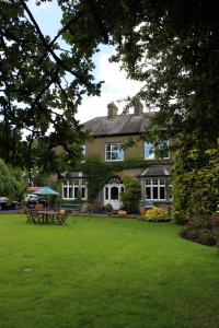 a house with a green lawn in front of it at Garrane House in Croom