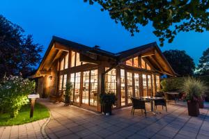 a house with glass windows and a patio at Chalet Oberstdorf in Oberstdorf