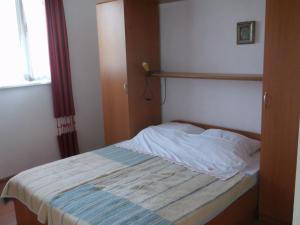 Postel nebo postele na pokoji v ubytování apartmani srecko