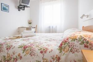 Postel nebo postele na pokoji v ubytování Pansion Oliva