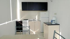 Kuchyň nebo kuchyňský kout v ubytování Apartmani Kaštelan + 20 fotografií
