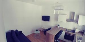 Телевизор и/или развлекательный центр в APARTMAN ERCEGOVIĆ