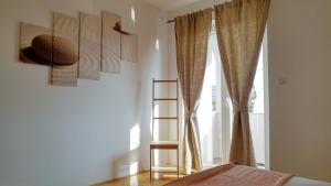 Postel nebo postele na pokoji v ubytování Apartmani Kaštelan