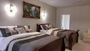 Кровать или кровати в номере The White House Boutique B&B