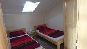 Postel nebo postele na pokoji v ubytování Villa Vlajina