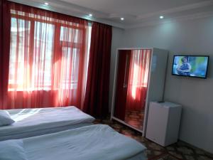 Ένα ή περισσότερα κρεβάτια σε δωμάτιο στο Hotel Noy