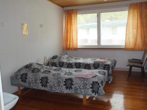 a living room with a couch and a window at Bed & Breakfast Pohjan Tuli in Utsjoki +10 photos