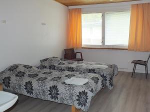 a room with a couch and a bed in it at Bed & Breakfast Pohjan Tuli in Utsjoki