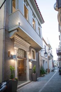 a building with a door on a street at Onar Superior Suites in Rethymno