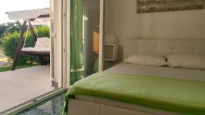 Postel nebo postele na pokoji v ubytování Apartmani Kaštelan
