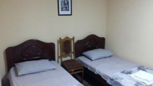 Postel nebo postele na pokoji v ubytování Guest House Kldiashvili