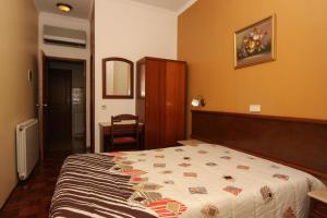 Postel nebo postele na pokoji v ubytování Hotel Leiriense