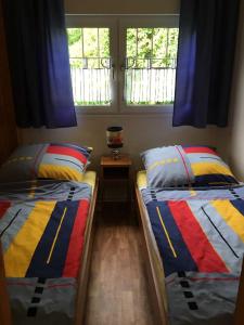 Posteľ alebo postele v izbe v ubytovaní Bungalowfarm