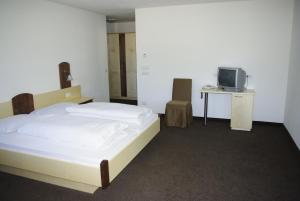 Postel nebo postele na pokoji v ubytování Hotel Montana