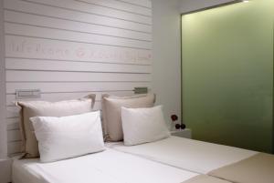Postel nebo postele na pokoji v ubytování Kouros Seasight Hotel
