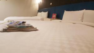 Postel nebo postele na pokoji v ubytování Walker Hotel - Zhengyi