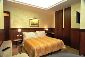 a hotel room with a bed in a room at Residenza Matteucci in Rome