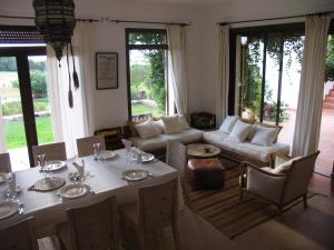 a living room with a table and a couch at Dar Al Manar in El Jadida