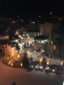 an aerial view of a large building at night at Demisos Caves Hotel in Urgup