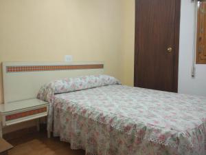 Кровать или кровати в номере Hospederia Montes