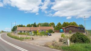 a house on the side of a road at Greenacres Holiday Cabins in Leuchars