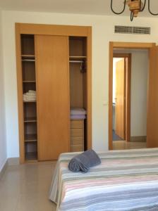 Łóżko lub łóżka w pokoju w obiekcie Apartamento Hacienda San Manuel