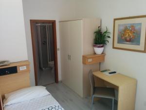 Postel nebo postele na pokoji v ubytování Hotel Gardesana