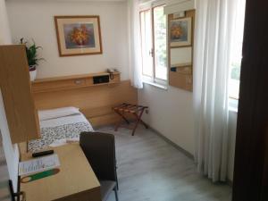 Postel nebo postele na pokoji v ubytování Hotel Gardesana