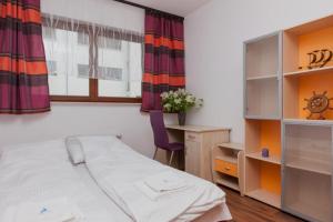 Posteľ alebo postele v izbe v ubytovaní Apartamenty Platan