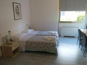 Postel nebo postele na pokoji v ubytování Hotel Gardesana