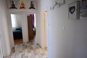 a living room with a hallway with a room with at Apartment Ostendplatz in Stuttgart