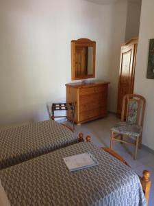 Posteľ alebo postele v izbe v ubytovaní Albergo Villa Mario