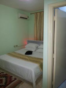 Ein Bett oder Betten in einem Zimmer der Unterkunft My Home Petra