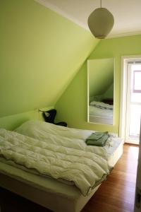 Postel nebo postele na pokoji v ubytování Østre Strandvej 49