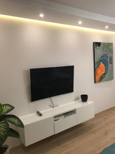 Televízia a/alebo spoločenská miestnosť v ubytovaní Apartament No.1 + 2 fotografie