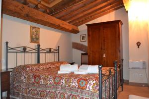 Säng eller sängar i ett rum på Antico Borgo Casalappi