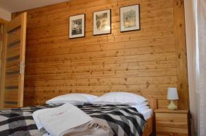 Säng eller sängar i ett rum på Apartamenty "Maryna House" Zakopane