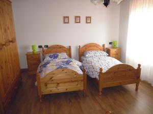 Letto o letti in una camera di B&B Emma