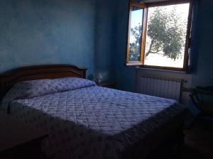 En eller flere senge i et værelse på La Vignara