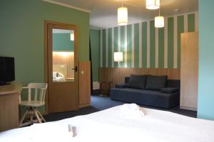 Postel nebo postele na pokoji v ubytování Alba Hotel